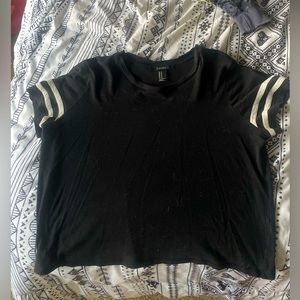 Black crop top with white lined sleeves